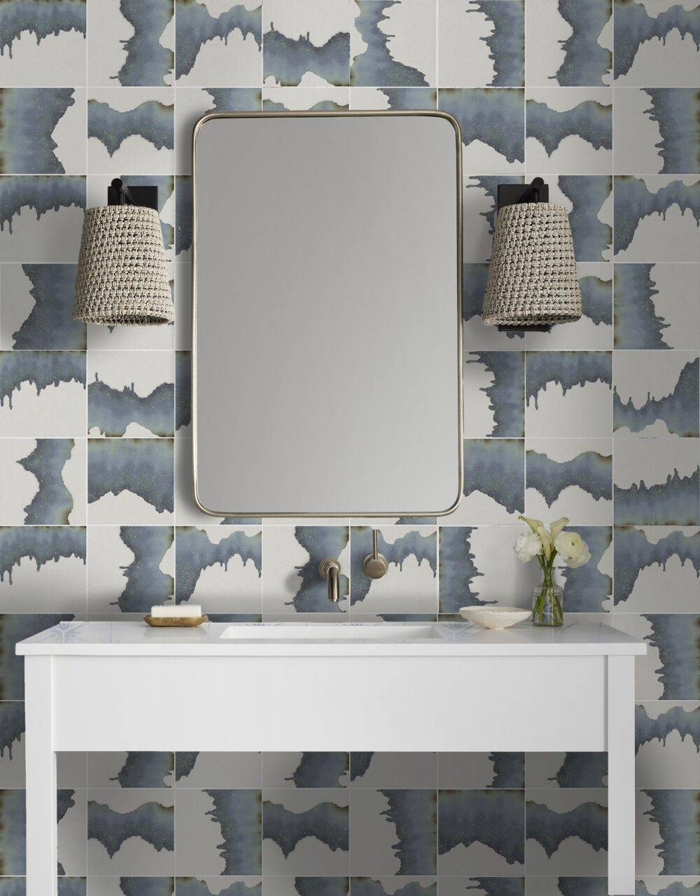 A coastal chic bathroom vanity with abstract blue tile. 